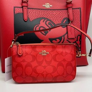 Coach Nolita 19 In Signature Canvas
IM/Miami Red